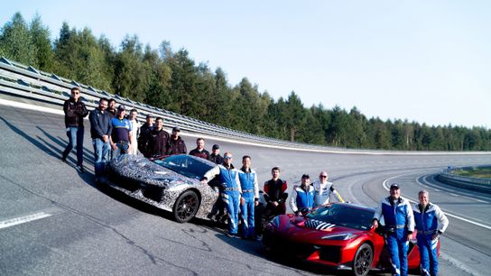 Members of the Corvette team, including General Motors President Mark Reuss on the track in Papenburg, Germany. Preproduction models shown. Actual production model may vary.